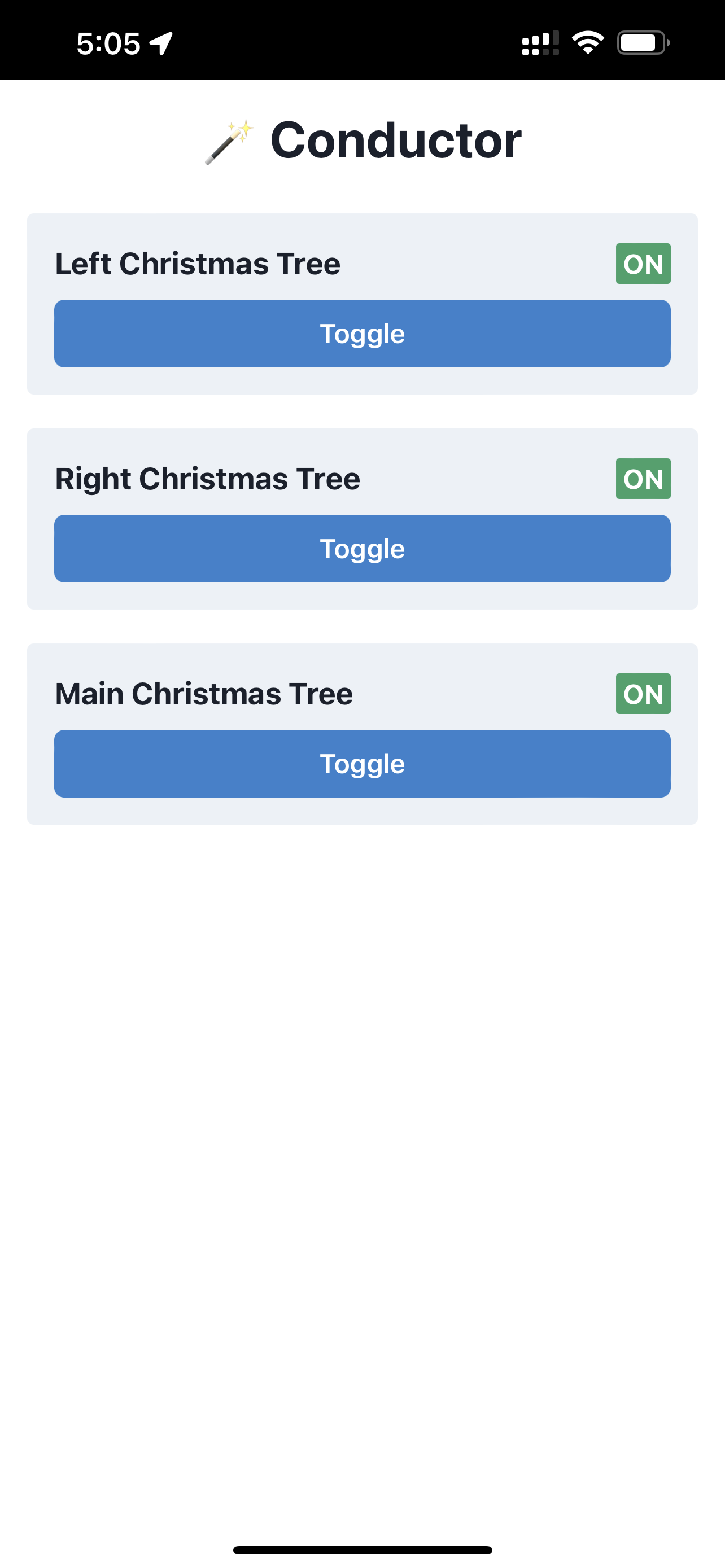 A screenshot from a mobile device showing the interface of Wemo Conductor. Three Christmas trees are on.